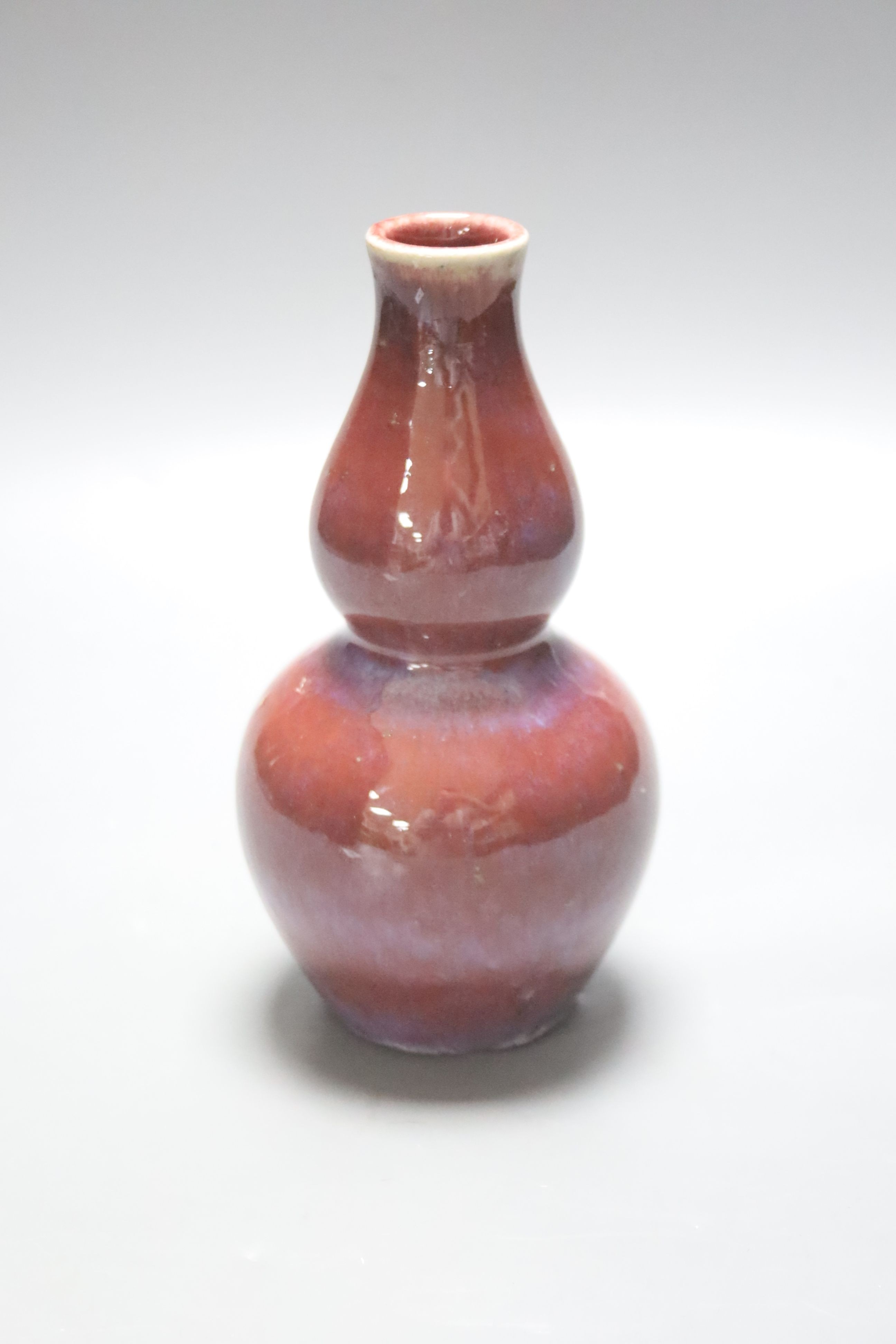 A Chinese flambé double gourd vase, 18cm